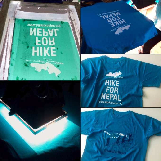 Hike for Nepal t-shirts on the screen-printing table and finished, in blue with the white mountain mark
